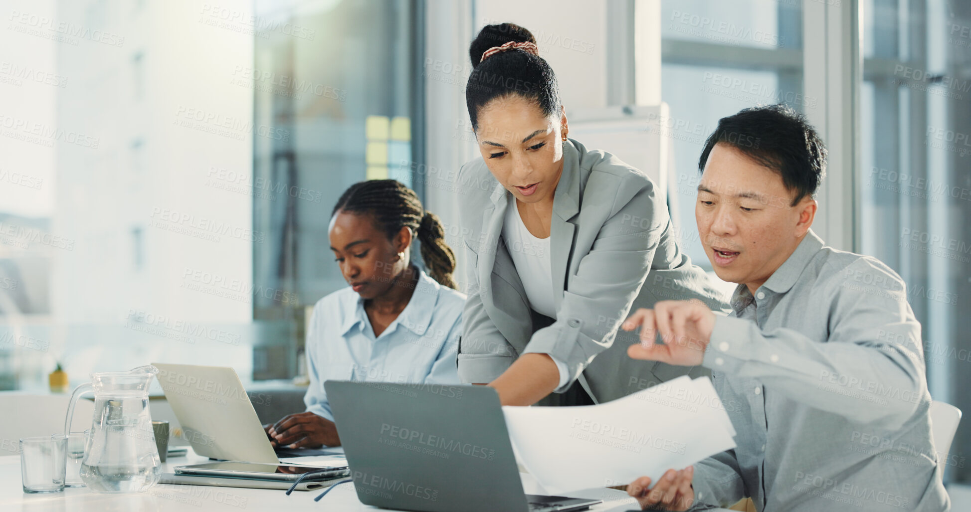 Buy stock photo Business people, laptop and meeting with feedback for document, proposal or accounting report at office. Group of employees, paperwork and discussion for company revenue, profit or financial growth