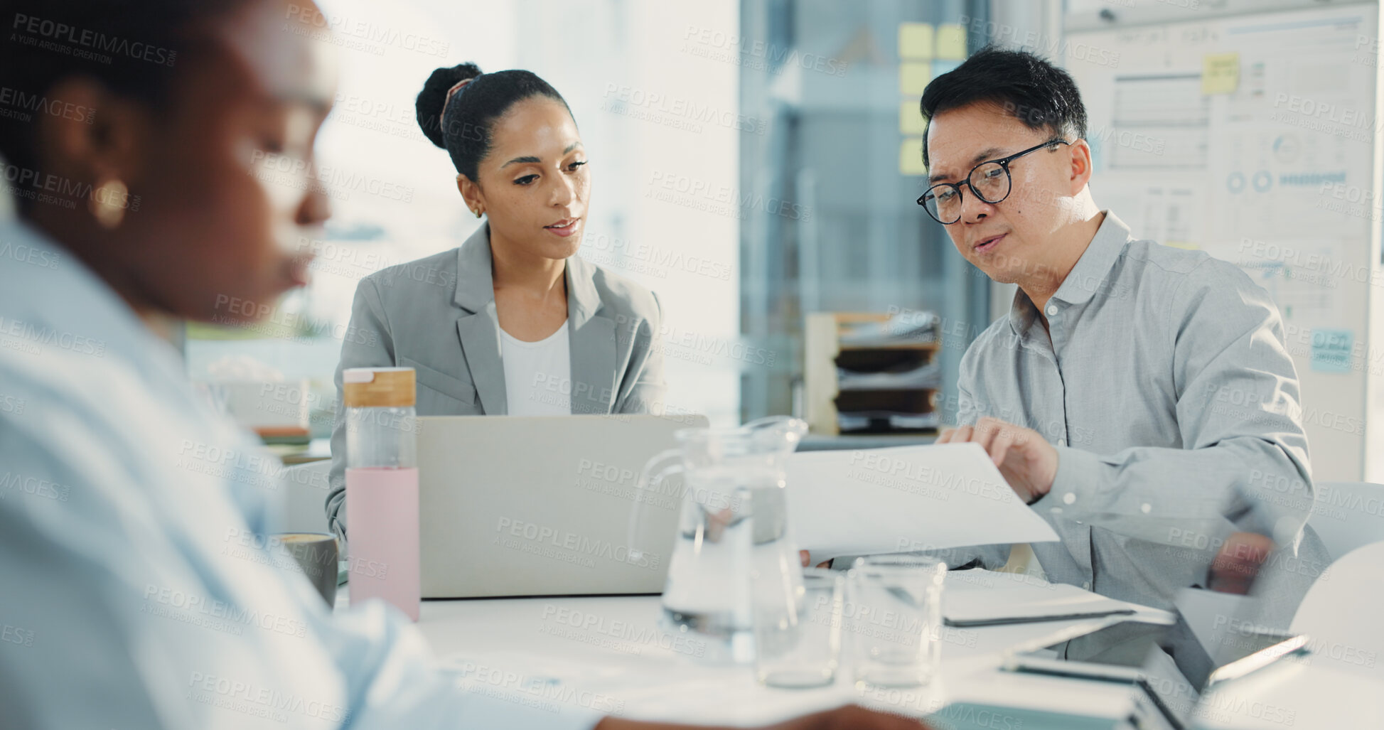 Buy stock photo Business people, laptop and meeting with discussion for document, proposal or accounting report at office. Group of employees, paperwork and feedback for company revenue, profit or financial growth
