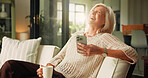 Home, smartphone and old woman on sofa, funny meme and internet social media. Apartment, happiness and mature person with cellphone, laughing and message to contact, smile and app for online humor