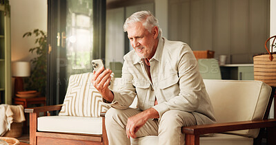 Buy stock photo Senior man, phone and reading on sofa with laughing, smile or funny article on website in living room. Elderly person, retirement and happy with scroll, search and mobile network with app in home