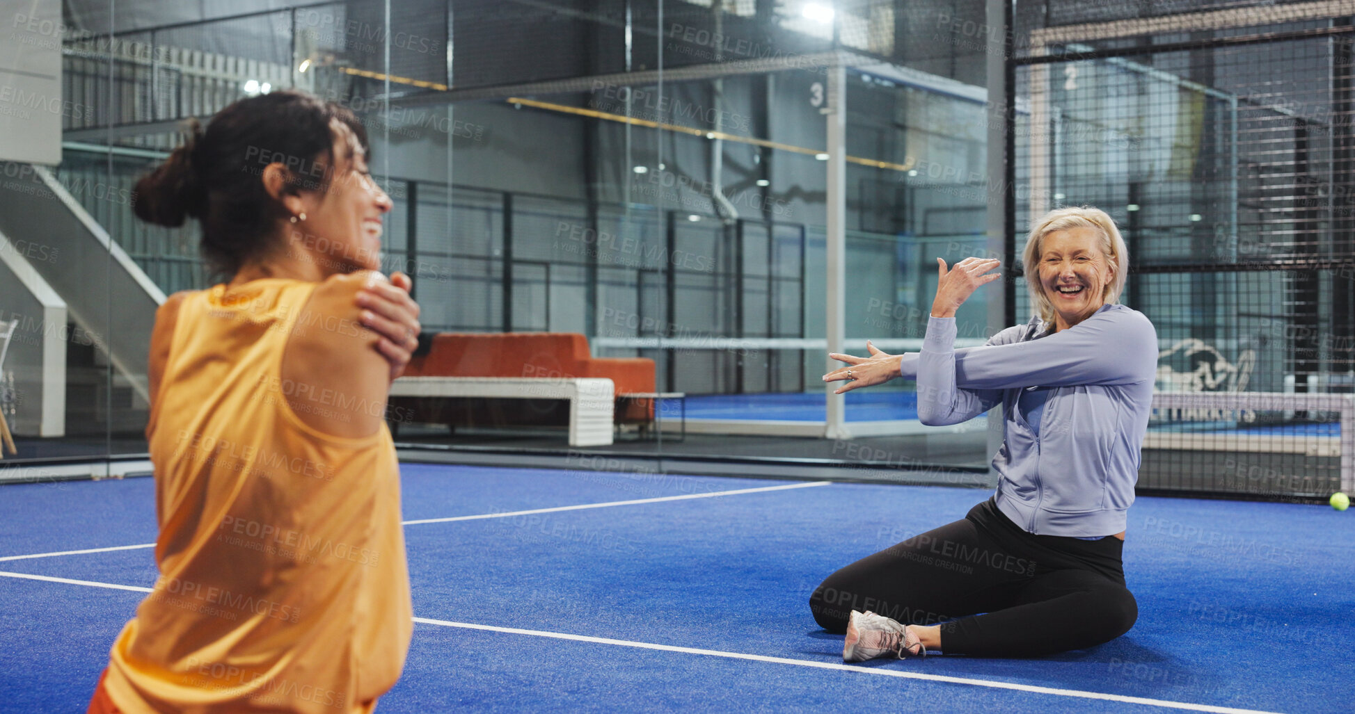 Buy stock photo Women, coach and stretching arms at padel club, smile and advice for training, routine and talk. Personal trainer, senior person and happy with warm up, fitness and chat with exercise on tennis court