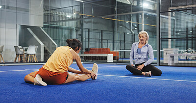 Buy stock photo Padel, sports and women on court stretching to prepare for game, match and competition. Indoor, fitness and mature people warm up for exercise, workout and training for practice, health and tennis
