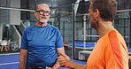 Padel, coach and men on court, talking and planning for match, fitness and strategy for competition. Tennis player, mature people and preparing for game with instructor, team and discussion for sport