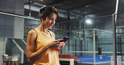 Buy stock photo Sport practice, woman and phone on court for padel training schedule, match results or update. Tennis player, person and smile with smartphone at indoor health club for fitness app and online score