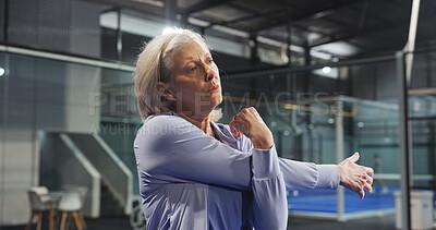 Buy stock photo Fitness, padel and old woman stretching on court for match preparation, start practice and workout. Retirement, senior person and arm warm up at indoor tennis club for sport performance and breathing