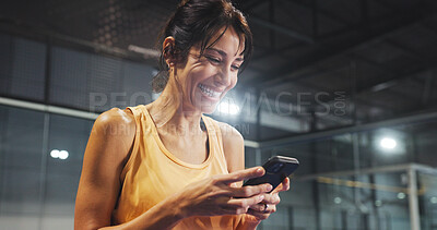 Buy stock photo Sport, woman and laughing with phone on court for funny text message, padel break or online meme. Tennis player, mature person or happy with smartphone at indoor health club for fitness joke or flare