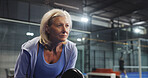 Padel, sports and mature woman ready for game, tournament and competition on indoor court. Tennis, senior athlete and person with racket for training, exercise and workout for challenge and fitness