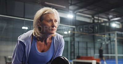 Buy stock photo Padel, sports and mature woman ready for game, tournament and competition on indoor court. Tennis, senior athlete and person with racket for training, exercise and workout for challenge and fitness