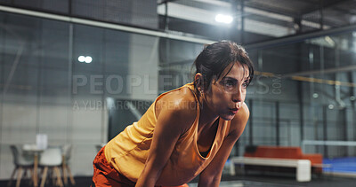 Buy stock photo Padel, sports and woman with sweat, tired and rest after game, match and training for challenge. Indoor court, break and person breathe with fatigue for workout, exercise and fitness for tennis