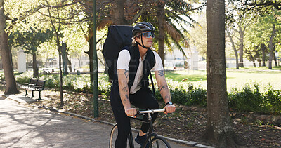 Buy stock photo Courier, bike and delivery with man in park for package distribution, carbon footprint and shipping. Eco friendly transport, cycling and ecommerce parcel with person outdoor for export and cargo