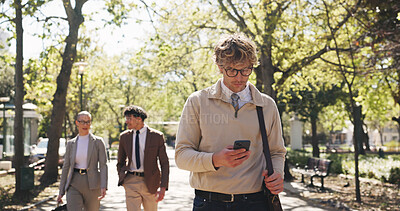 Buy stock photo Phone, walking and business man in park for communication, social media and search. Commute, networking app and connection with person and mobile outdoor for professional, contact and travel