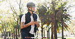 Courier, bike and phone with man in park for package distribution, delivery route app and shipping. Online order, cycling and ecommerce parcel with person and mobile outdoor for export and cargo