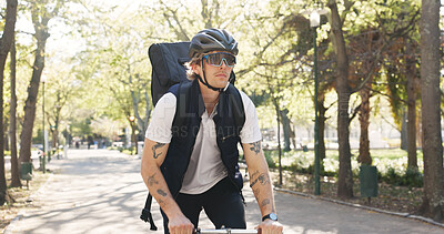 Buy stock photo Courier, bike and shipping with man in park for package distribution, carbon footprint and delivery. Eco friendly transport, cycling and ecommerce parcel with person outdoor for export and cargo