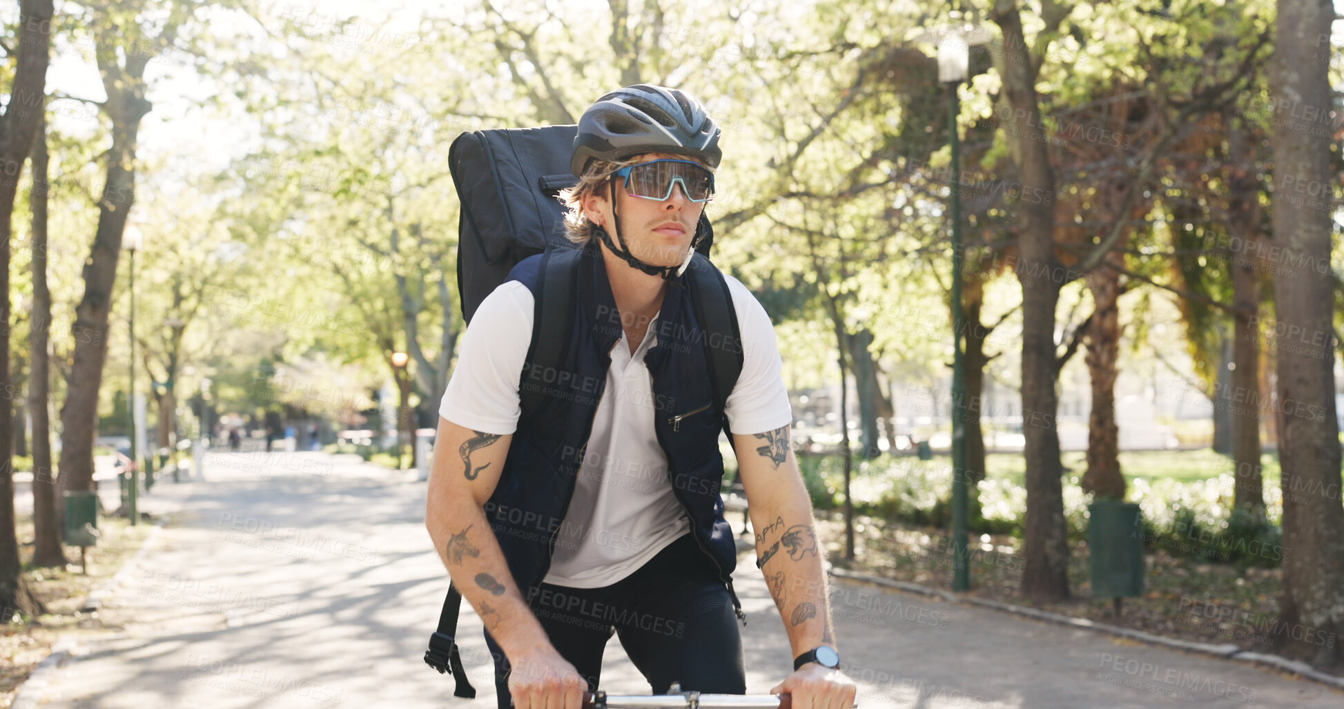 Buy stock photo Courier, bike and shipping with man in park for package distribution, carbon footprint and delivery. Eco friendly transport, cycling and ecommerce parcel with person outdoor for export and cargo