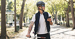 Shipping, bike and phone with man in park for package distribution, delivery route app and courier. Online order, cycling and ecommerce parcel with person and mobile outdoor for export and cargo
