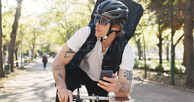 Buy stock photo Ecommerce, bike and phone with delivery man in park for package distribution, courier route app and shipping. Online order, cycling and tracking parcel with person and mobile outdoor for export