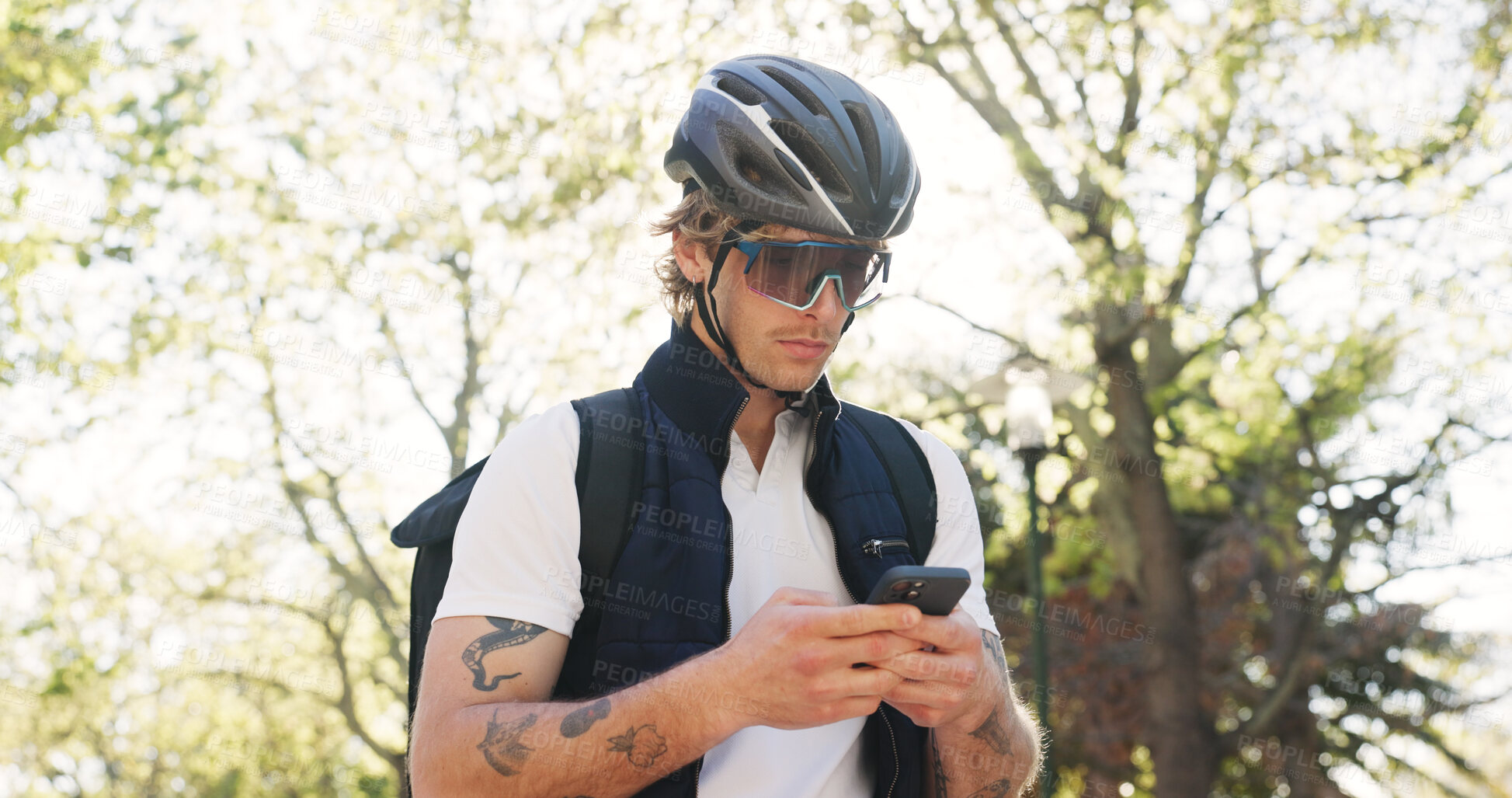 Buy stock photo Delivery, helmet and man in city, cellphone and internet with ecommerce app for food order. Outdoor, person and employee with smartphone, cyclist or connection with online review for courier services