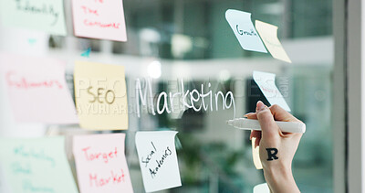Buy stock photo Advertising, hands and writing on glass wall for business growth, seo plan or target audience trends. Marketing, increase awareness and person at board with sticky note, strategy or goal for campaign