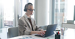 Woman, headset and laptop at office, financial review and customer support at investment company. Mature person, broker or advisor with computer, voip tech and feedback for stock market at agency