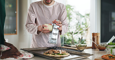 Buy stock photo Hands, friends and cooking pizza at house with meal prep, organic ingredients and healthy food. People, helping and grater with cheese toppings, Italian cuisine and culinary skills for homemade lunch