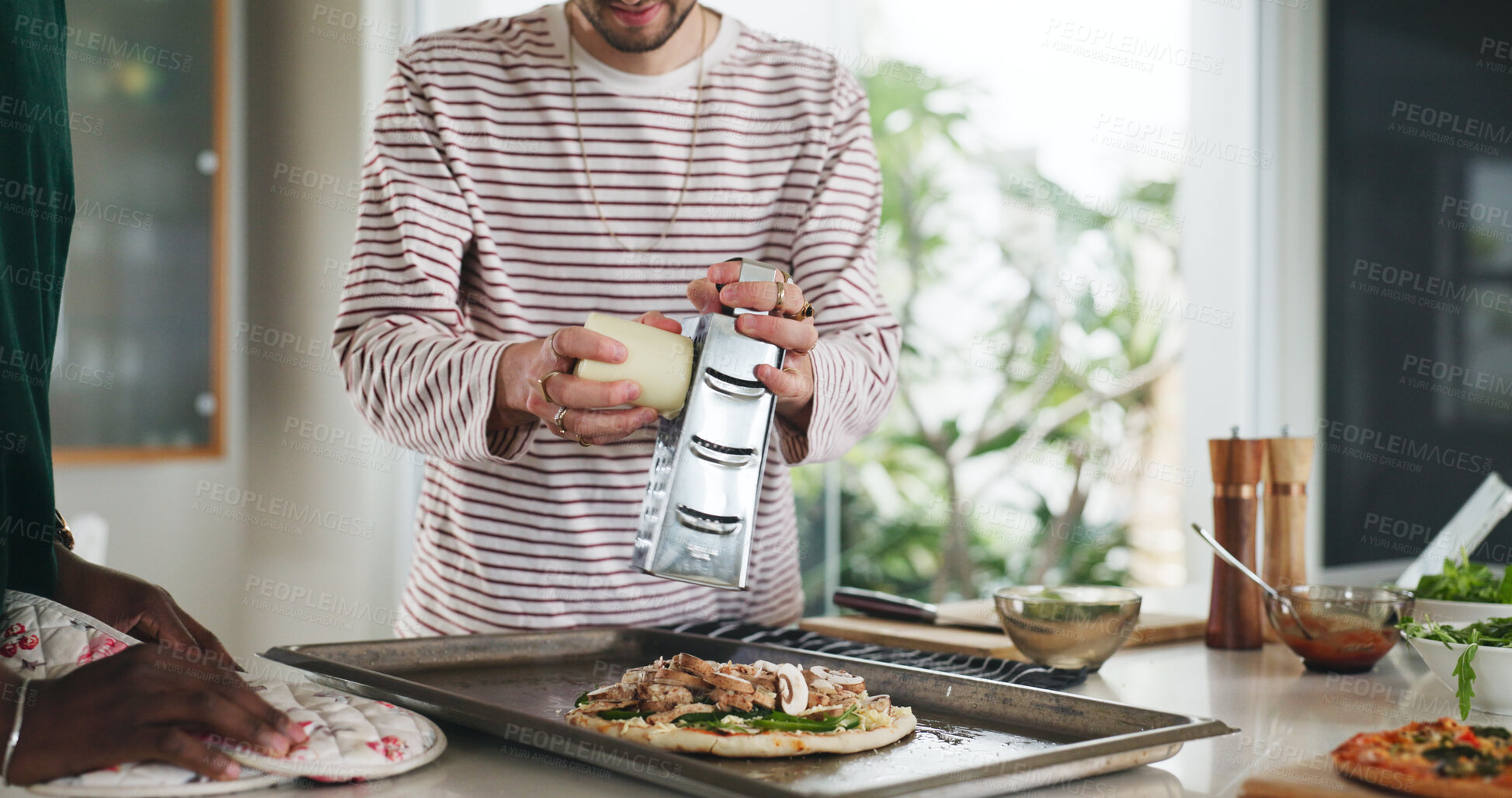 Buy stock photo Hands, friends and cooking pizza at house with meal prep, organic ingredients and healthy food. People, helping and grater with cheese toppings, Italian cuisine and culinary skills for homemade lunch