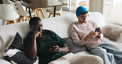 Buy stock photo Relax, phone and scroll with friends on sofa of home for social media, post comment or like update. Text message, reunion or online browsing with men in living room of apartment for communication app