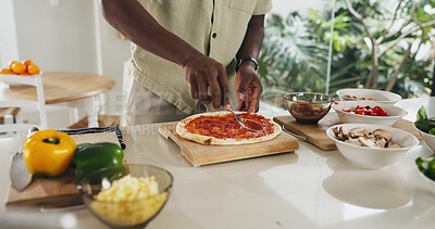Buy stock photo Hands, person and cooking pizza in kitchen with meal prep, organic ingredients and healthy food. Man, dough and spread sauce for Italian cuisine, vegetables and culinary skills for homemade lunch