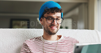 Buy stock photo Smile, tablet and man on sofa in home with social media, contact or scroll for networking. Notification, tech and person with communication for connectivity, online or mobile app in living room