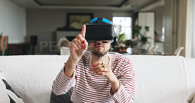 Buy stock photo Gaming, touch and virtual reality with man on sofa in home for interactive or online experience. Click, video game and vr headset with person in apartment for futuristic entertainment or streaming