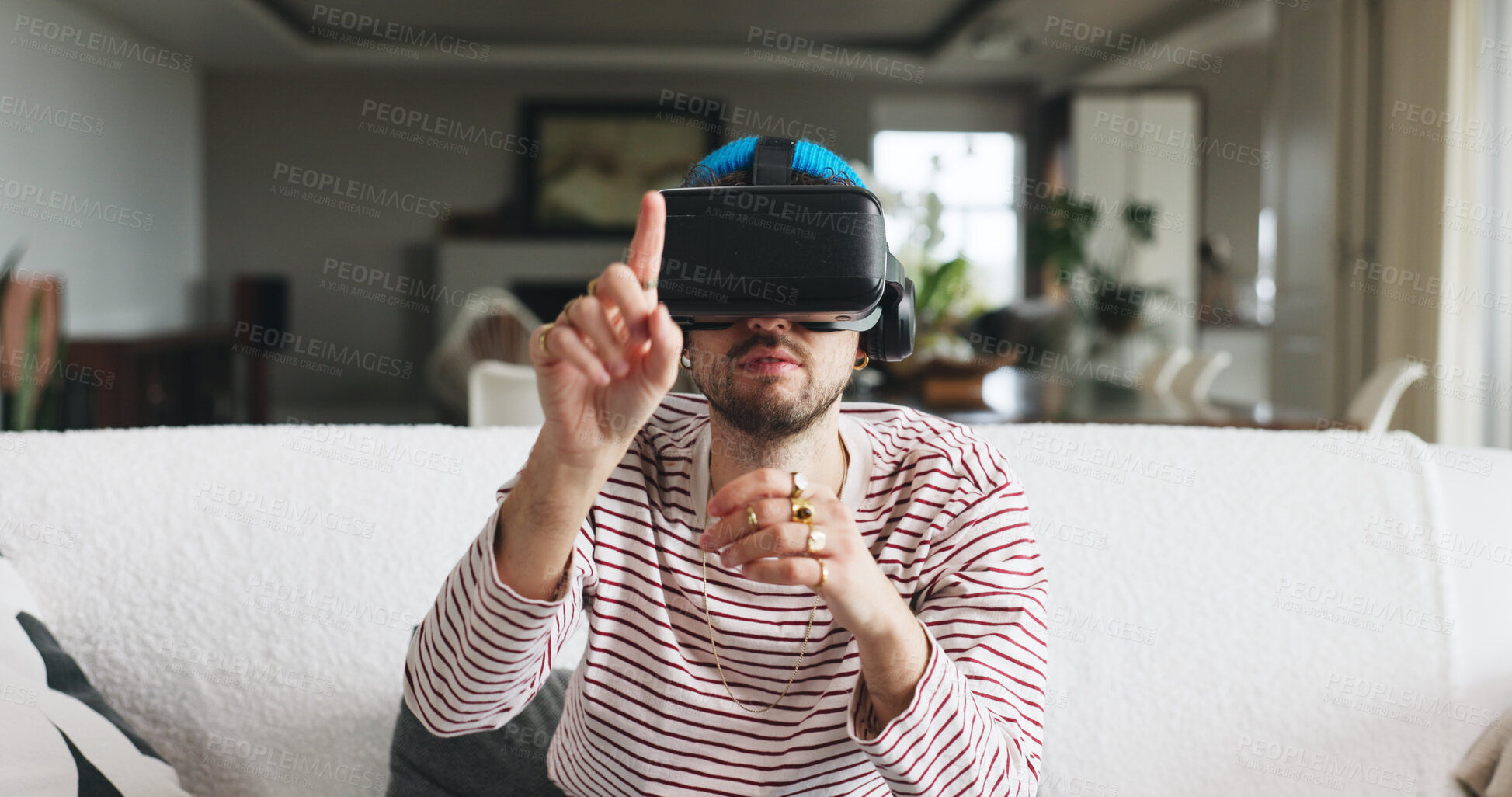 Buy stock photo Gaming, touch and virtual reality with man on sofa in home for interactive or online experience. Click, video game and vr headset with person in apartment for futuristic entertainment or streaming