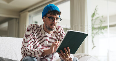 Buy stock photo Reading, tablet and man on sofa in home with social media, contact or scroll for networking. Notification, tech and person with communication for connectivity, online or mobile app in living room