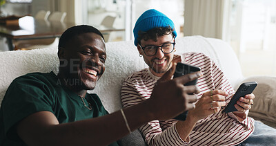 Buy stock photo Laughing, phone and sharing with friends on sofa in lounge of home together for social media. App, funny meme and relax with roommate people in apartment for browsing, internet search or streaming