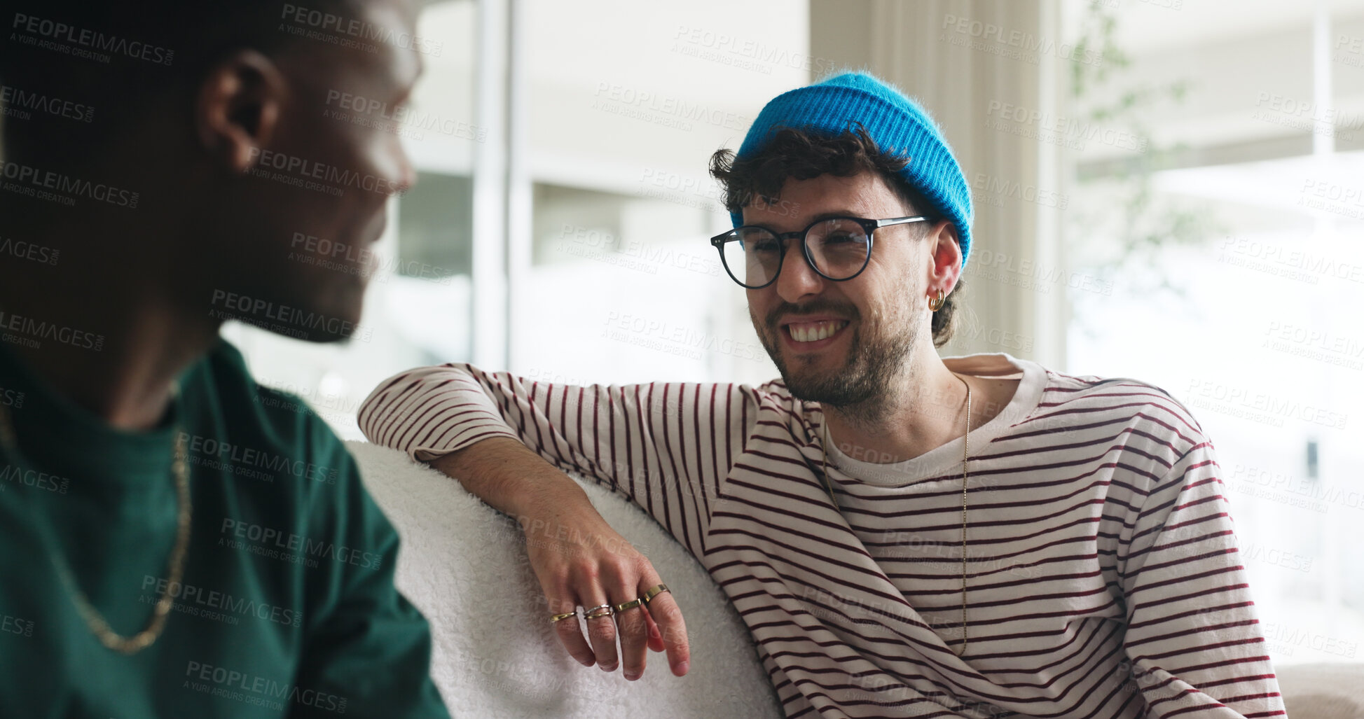 Buy stock photo Happy men, friends and laugh on sofa with gossip for funny story, bonding together or weekend hangout. People, chill and smile with conversation for wellness, connection and joke in home living room.