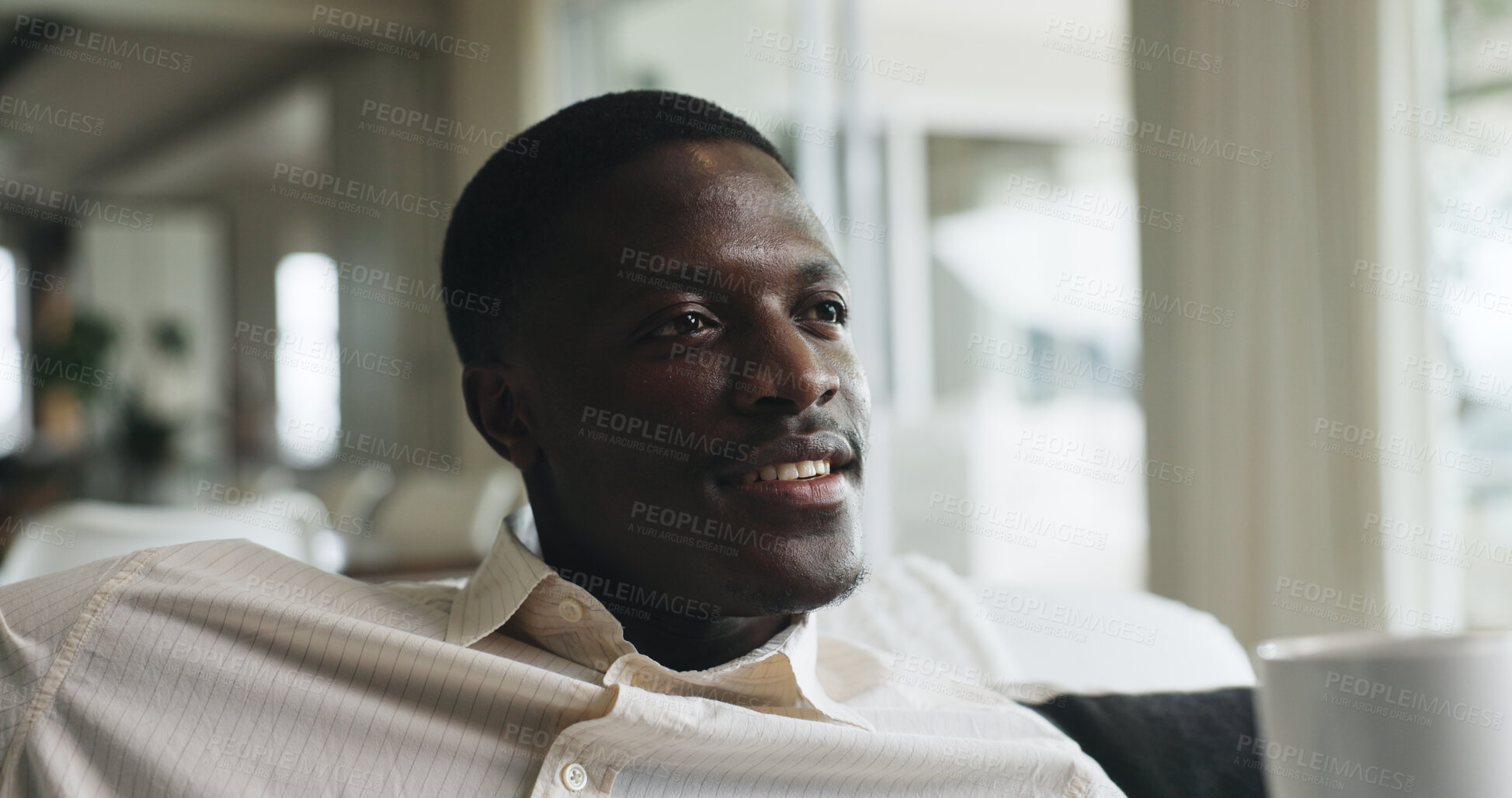 Buy stock photo Morning, reflection and black man on sofa with coffee, calm and thinking on weekend break. Relax, thoughts and male person in house with warm beverage, mindfulness and gratitude in Sunday routine.