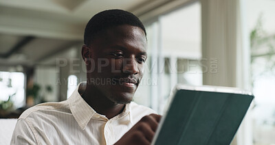 Buy stock photo Freelancer, tablet and reading with black man on sofa for editor feedback, blog writer or research. Online review, report and remote worker or person in living room of home for press release schedule