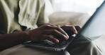 Laptop, remote work and typing with hands of man on sofa in living room of home for small business. Computer, planning and report with freelance employee in apartment for startup research online