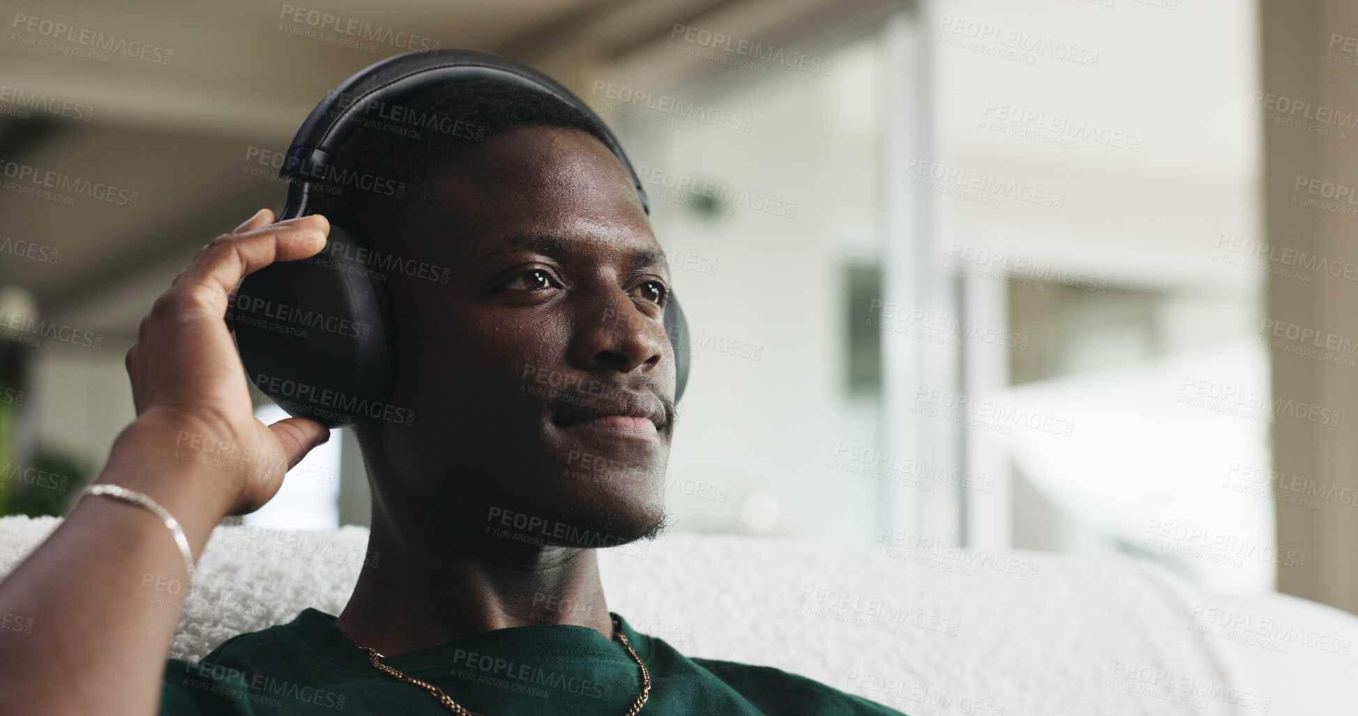 Buy stock photo House, headphones and black man on couch, thinking and listening to music, sound and playlist album. Calm, relax and person on sofa, audio tech and radio with daydreaming and streaming song in lounge