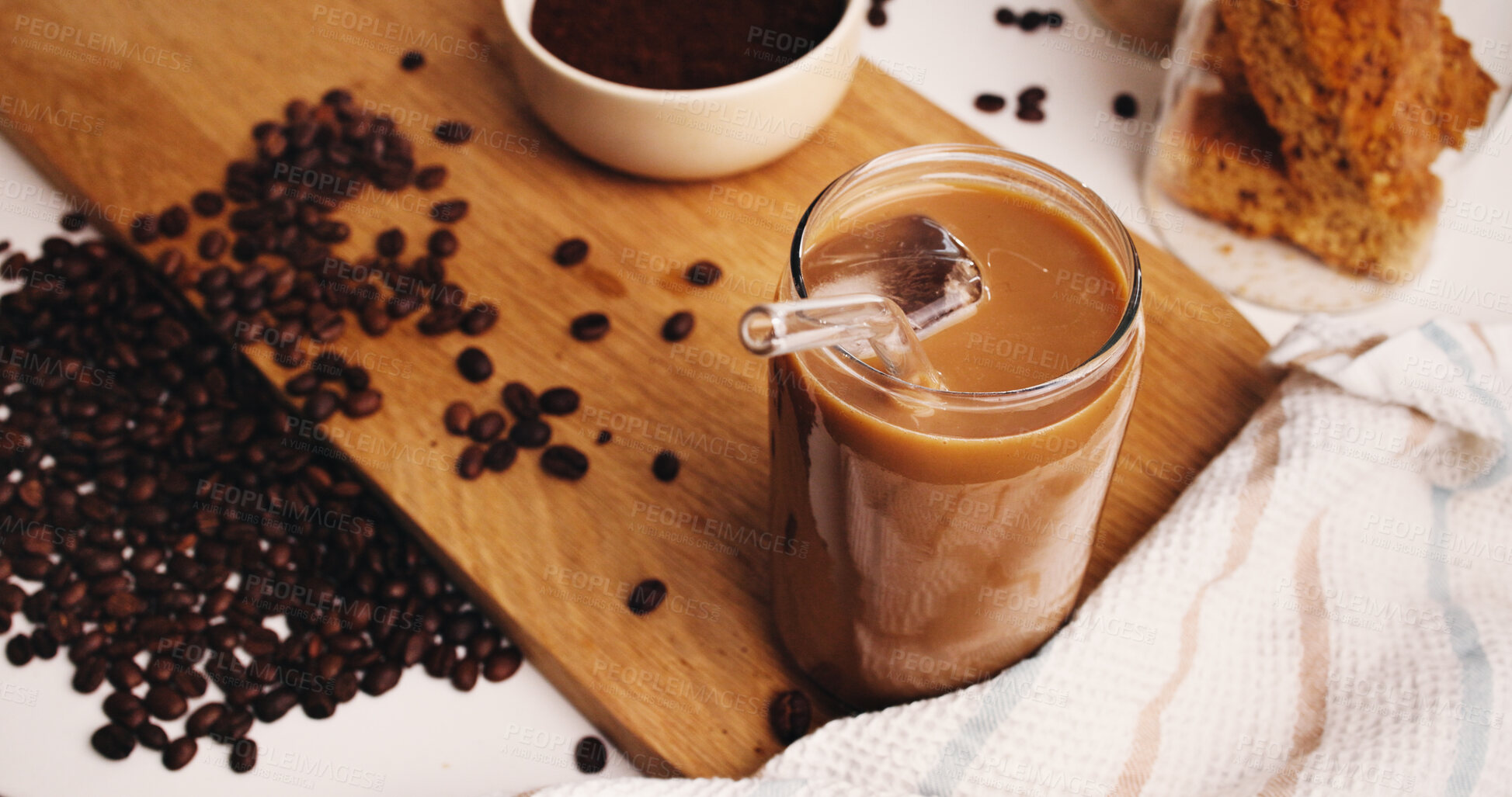 Buy stock photo Ice, coffee and straw in drink on table in kitchen of home for caffeine beverage, breakfast or morning brew. Cappuccino, cold latte and prepare with glass on counter of apartment for liquid and beans