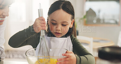 Buy stock photo Cooking, mother or kid in kitchen with whisk, learning motor skills or helping for breakfast preparation. Mixing eggs, guide or woman with girl for child development, support or concentration in home