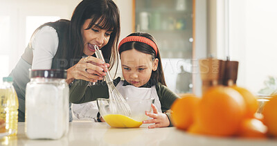 Buy stock photo Baking, bowl and girl in kitchen with mother for child development. ingredients or recipe learning. Egg whisk, how to and single parent woman teaching daughter in apartment for culinary baker skills