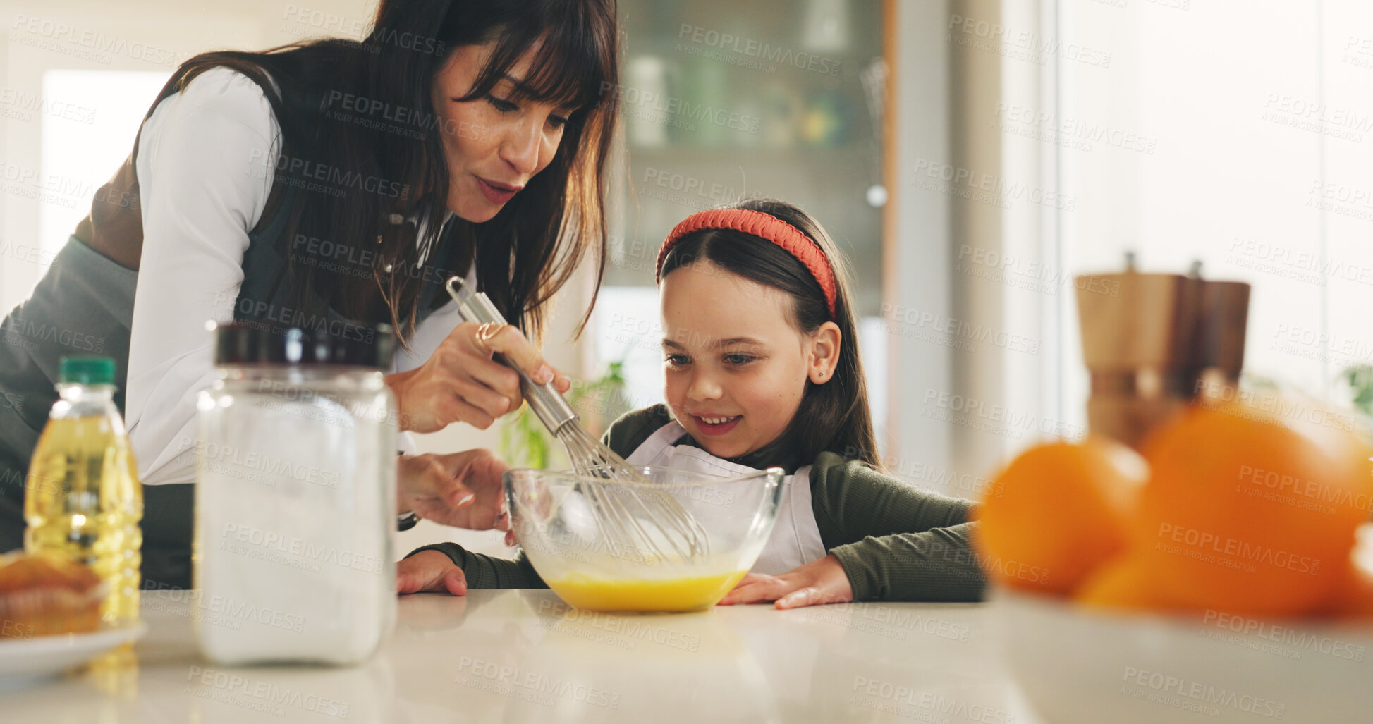 Buy stock photo Baking, whisk and girl in kitchen with mother for child development. ingredients or recipe learning. Egg beater, how to and single parent woman teaching daughter in apartment for baker skills