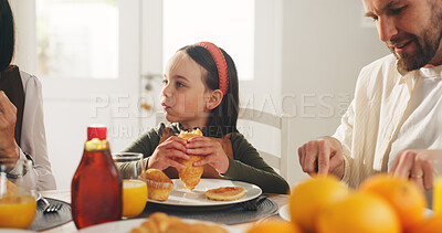 Buy stock photo Breakfast, croissant and eating with family in dining room of home together for meal or nutrition. Bite, food or morning with mother, father and daughter in apartment for diet, health or hunger
