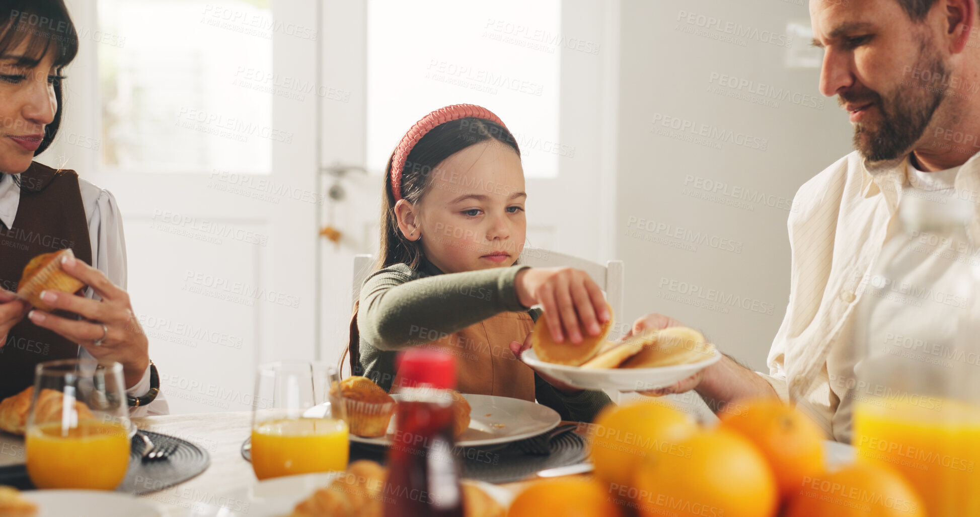 Buy stock photo Child, pancakes and breakfast with family for morning snack, meal or eating together in home. Daughter, mom and dad with flapjacks, juice or dessert for muffins, oranges or vitamin C on dining table