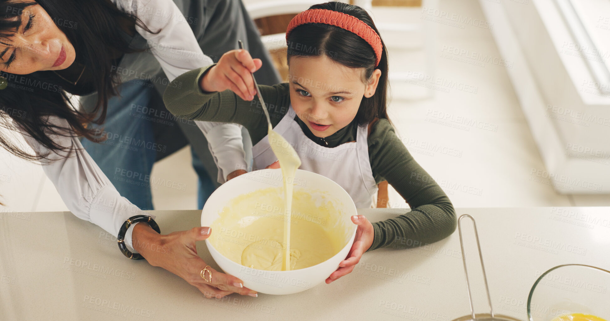 Buy stock photo Baking, mother or kid with batter on kitchen counter, meal prep or help with dessert in family home. Learning, above or woman with girl to teach cooking skill, guide or support for consistency check
