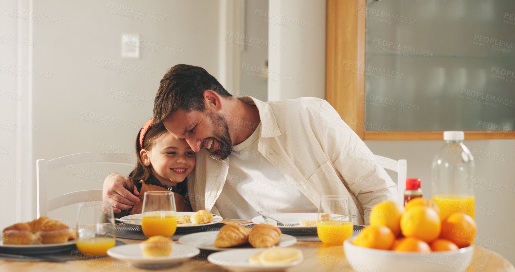 Buy stock photo Happy dad, child and hug with breakfast in home for love, care or bonding together on dining table. Father, kid or daughter with orange juice or croissant for embrace, morning meal or snack in house