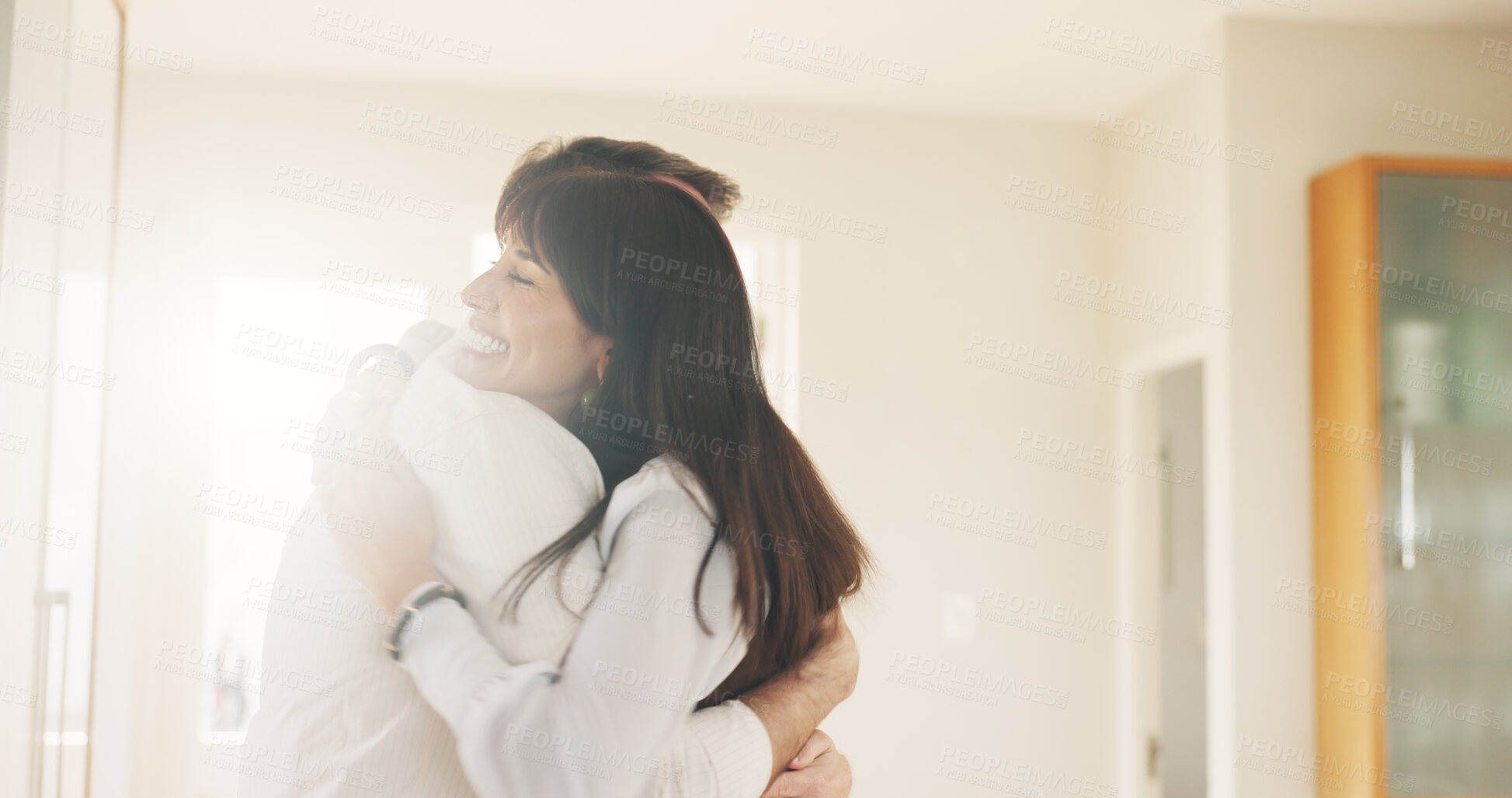 Buy stock photo Happy couple, hug or love with embrace in home for relationship, commitment or trust together. Man, woman or flare with smile, comfort or romance for valentines day, bonding or weekend break in house