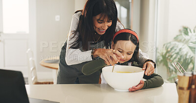 Buy stock photo Baking, mother or child with mixing bowl on kitchen counter, meal prep or help with dessert in family home. Learning, laptop and happy woman with girl to teaching cooking skills, guidance or support