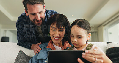 Buy stock photo Tablet, relax and parents with child on sofa in home for playing educational video game on app. Happy, digital technology and girl kid with mom and dad for watching movie in living room at house.