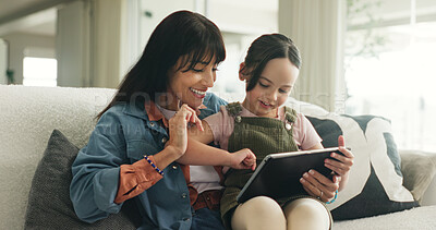 Buy stock photo Bonding, learning or tablet with mother and daughter on sofa in living room of home for development. App, education or reading with girl child and single parent woman in apartment for elearning