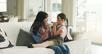 Buy stock photo Relax, playful and mother with daughter on sofa of family home for bonding, support and love. Connection, happiness and affection with woman and child in living room of apartment for trust and care